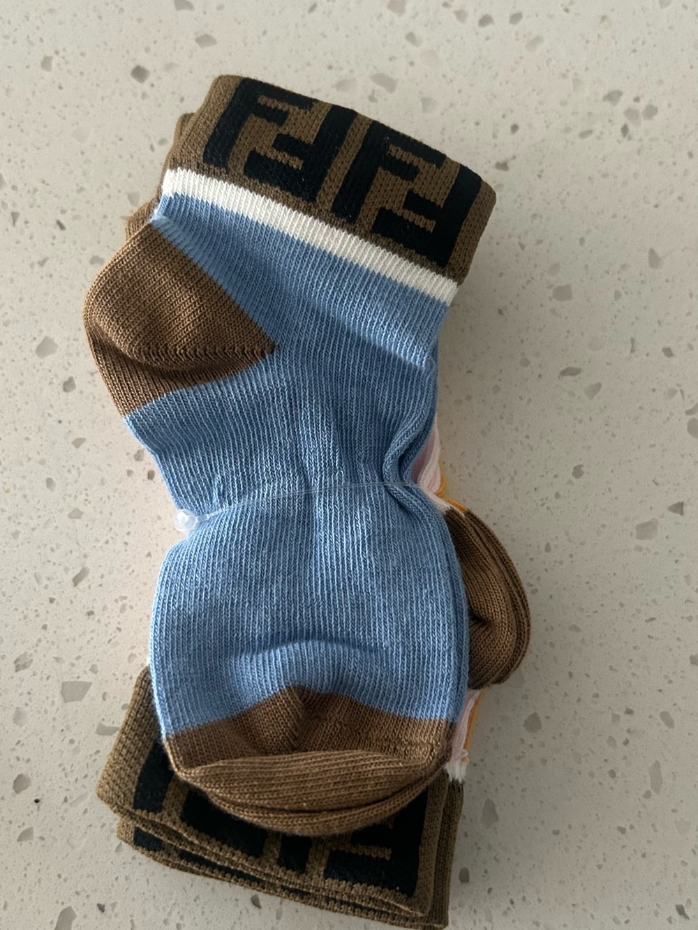 Fendi Kids Cream Drawstring Pouch with Teal Logo and Yellow Brown Socks